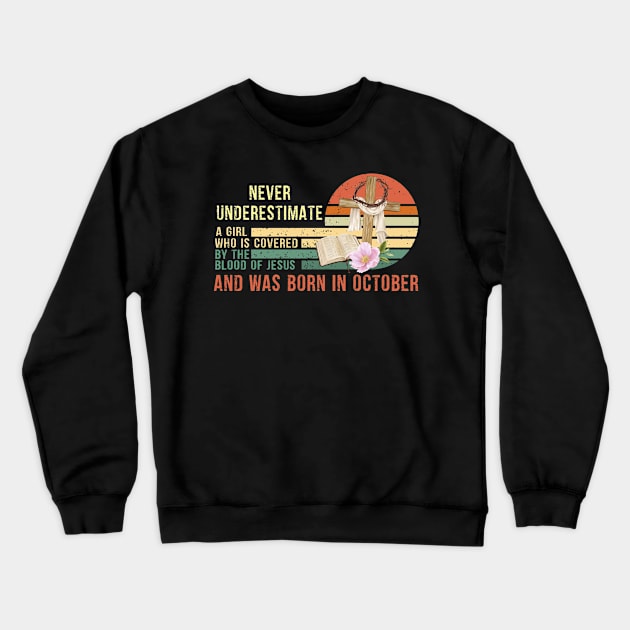 Never Underestimate a Girl Who is covered By the Blood of Jesus and was born in October Gift Crewneck Sweatshirt by peskybeater